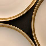 7 flat plates in porcelain of Limoges Bernardaud, decoration of golden Greek, XXth century