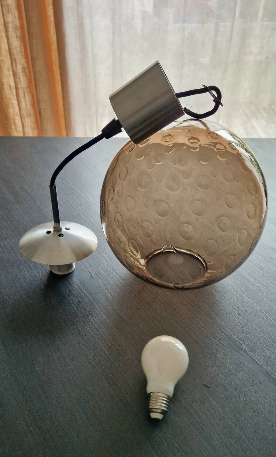 Smoked glass ball pendant light by Raak 1970
