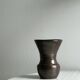 Dark brown ceramic vase, flared shape, smooth finish, classic style