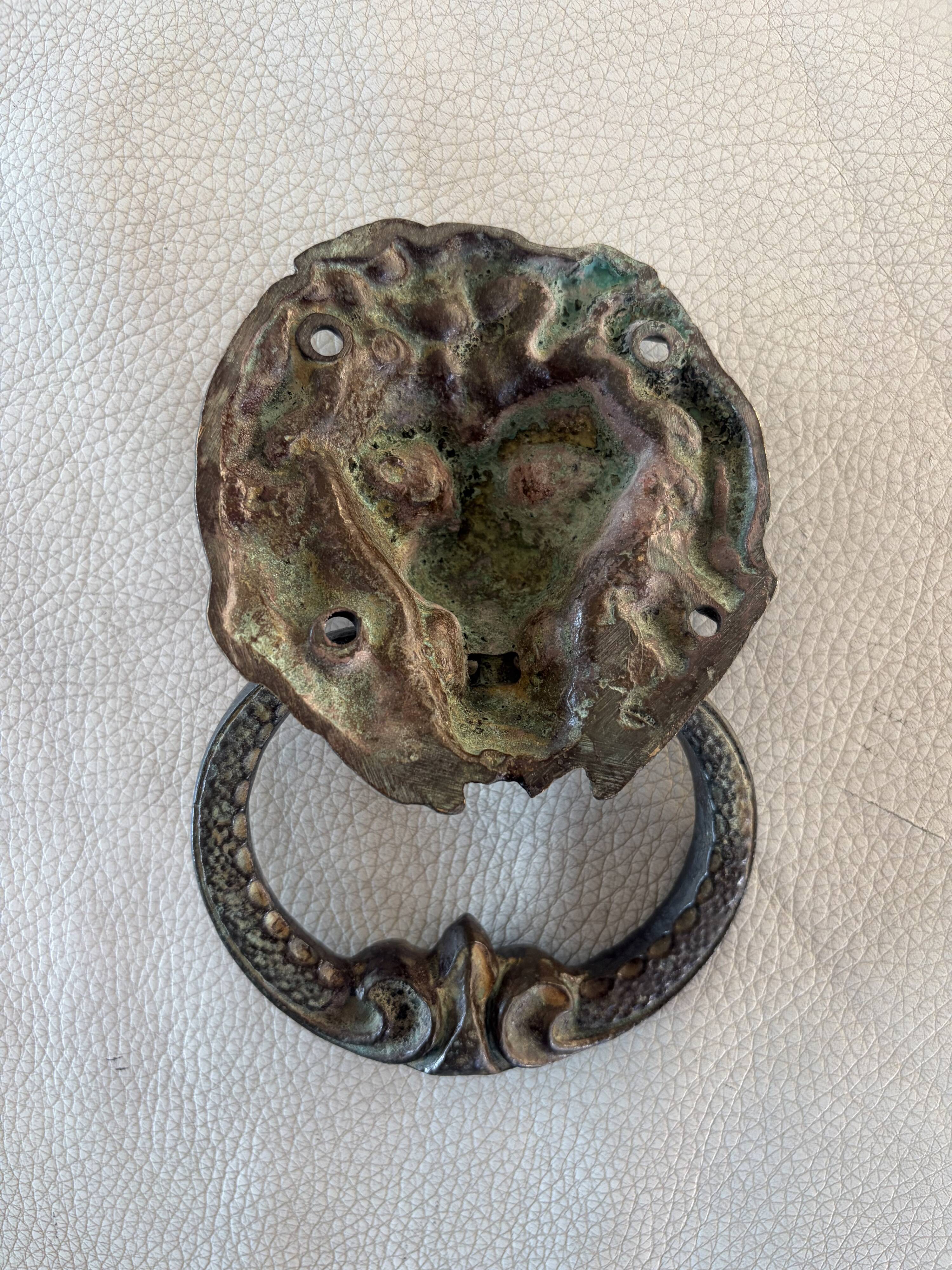 Bronze lion door knocker
