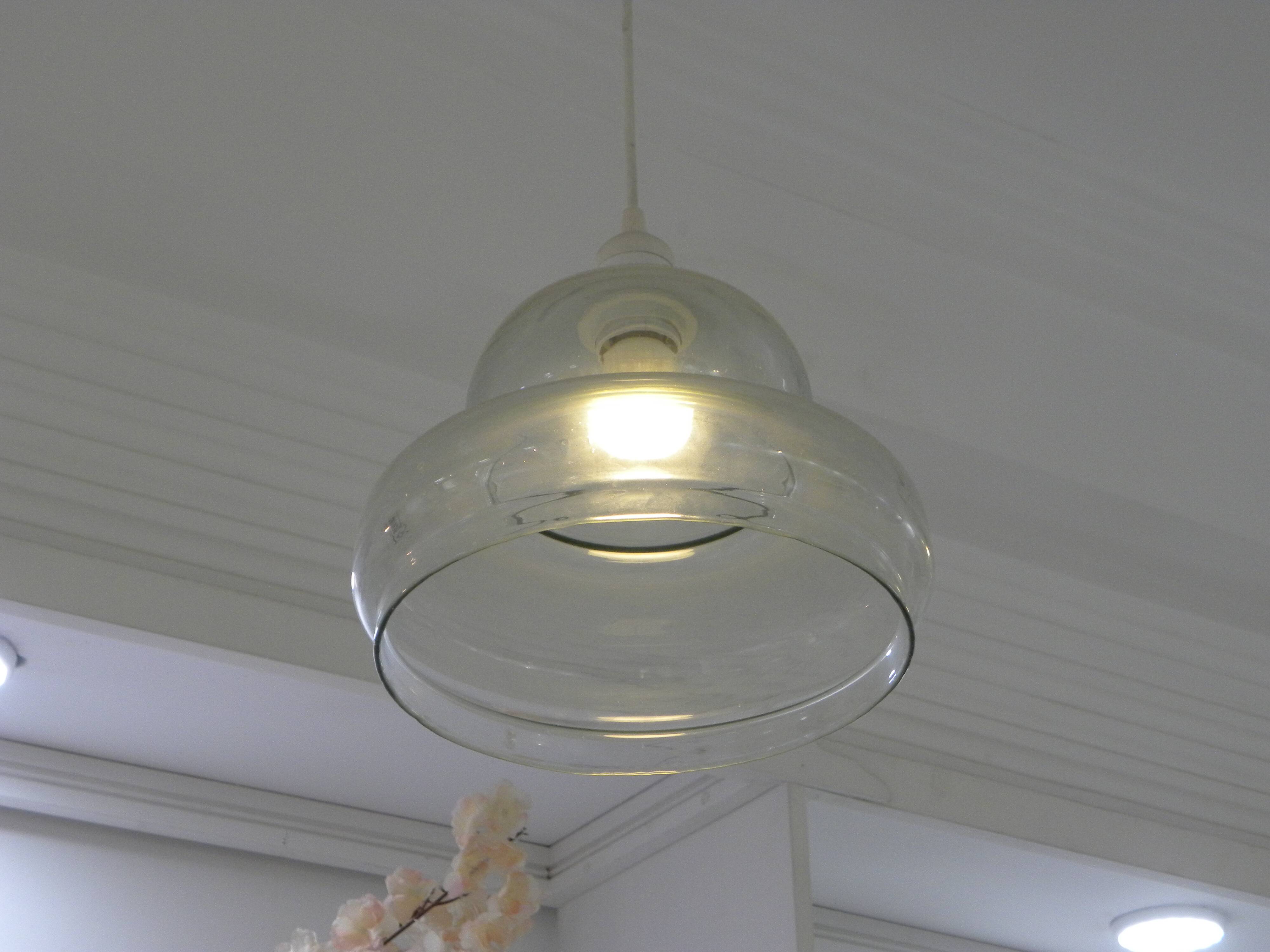 Suspended lamp in transparent blown glass, modern, minimalist, timeless style.