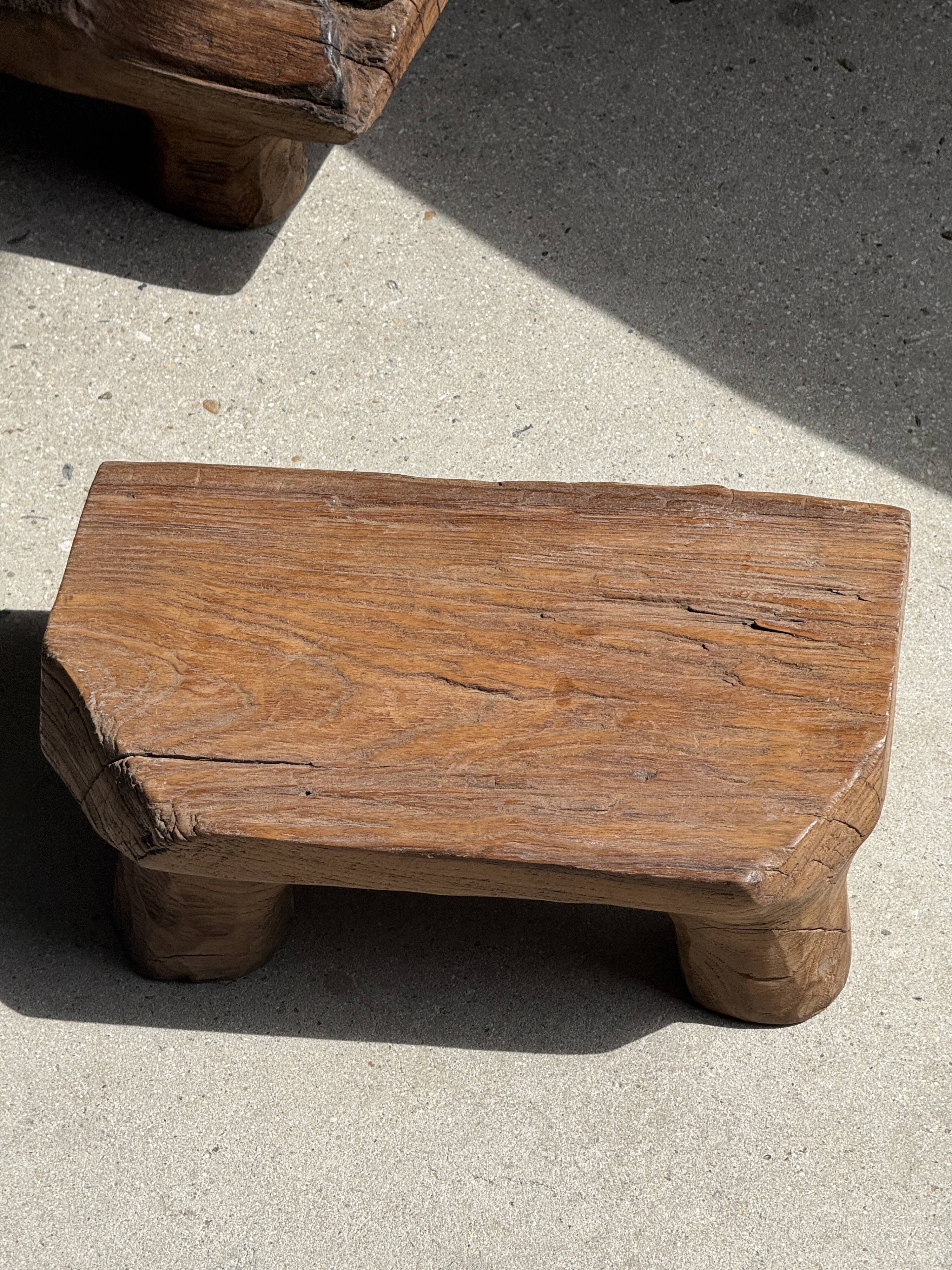 Small stool, teak footrest with short cut corners.