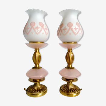 Duo of pink opaline relief lamps and gilded bronze