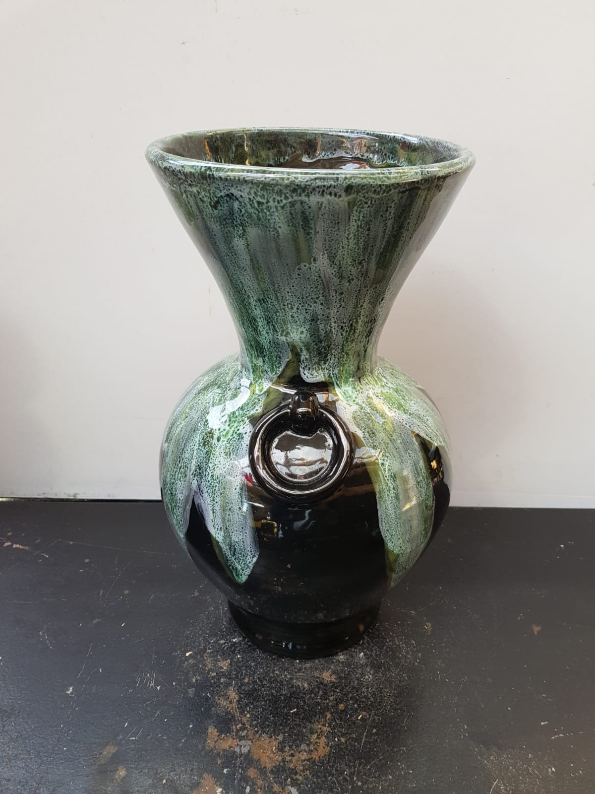 Old black enamelled ceramic Gaubier vase with green white vintage drips