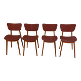 Set of 4 designer chairs in oak and red leatherette from the 1960s