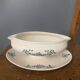 Antique sauce boat in Longchamp faience with its underplate – glazed decoration.