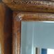 Wooden hanging mirror with vintage carved knot