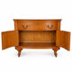 Half-moon commode from 1900 in lemon tree veneer, curved shape.