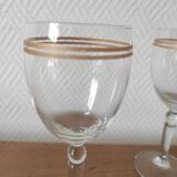 Set of 6 glasses with gold band decorations.