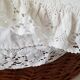 Old rattan bassinet and bedding