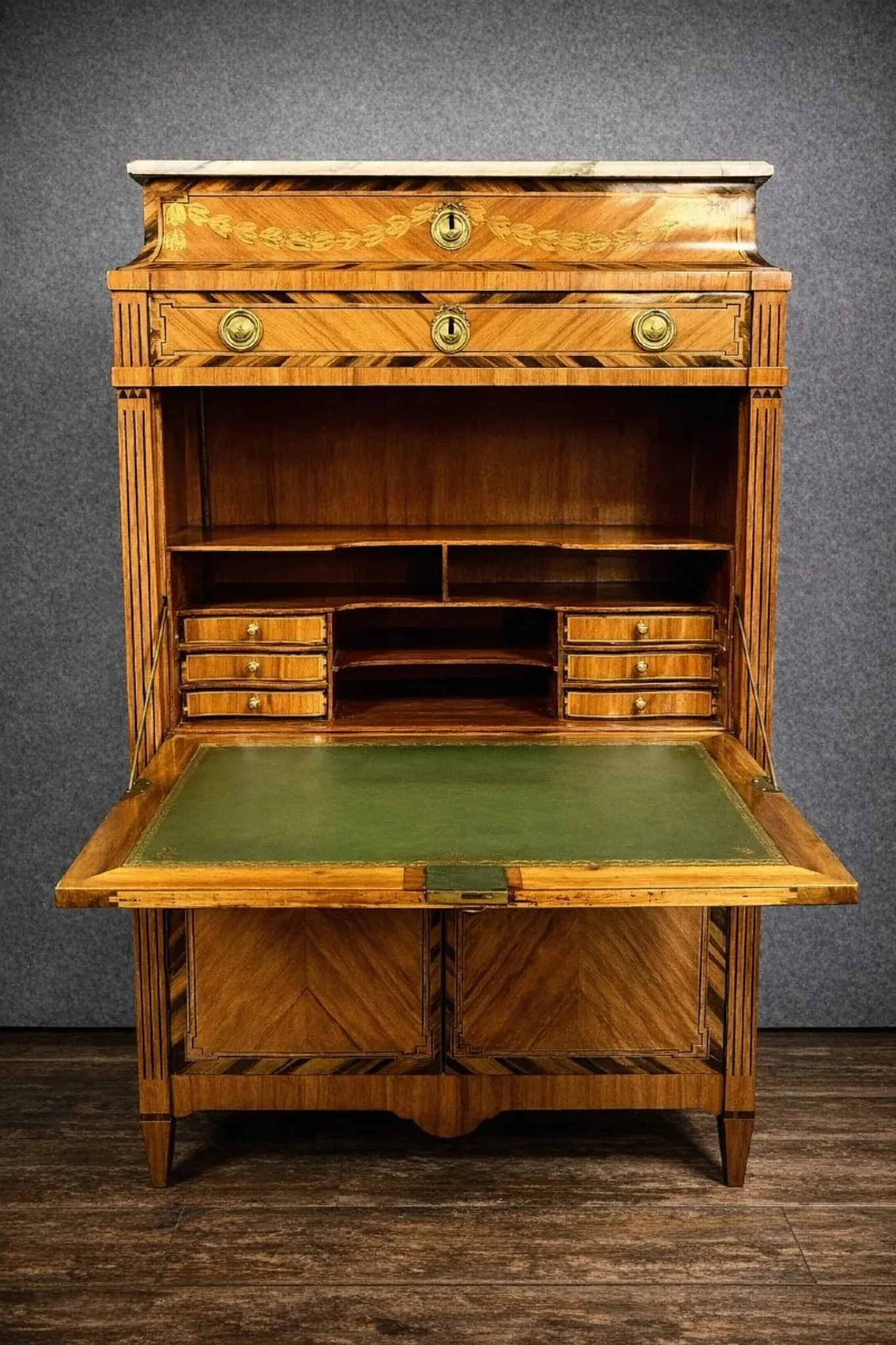 Secretary from the Louis XVI era in precious wood marquetry.