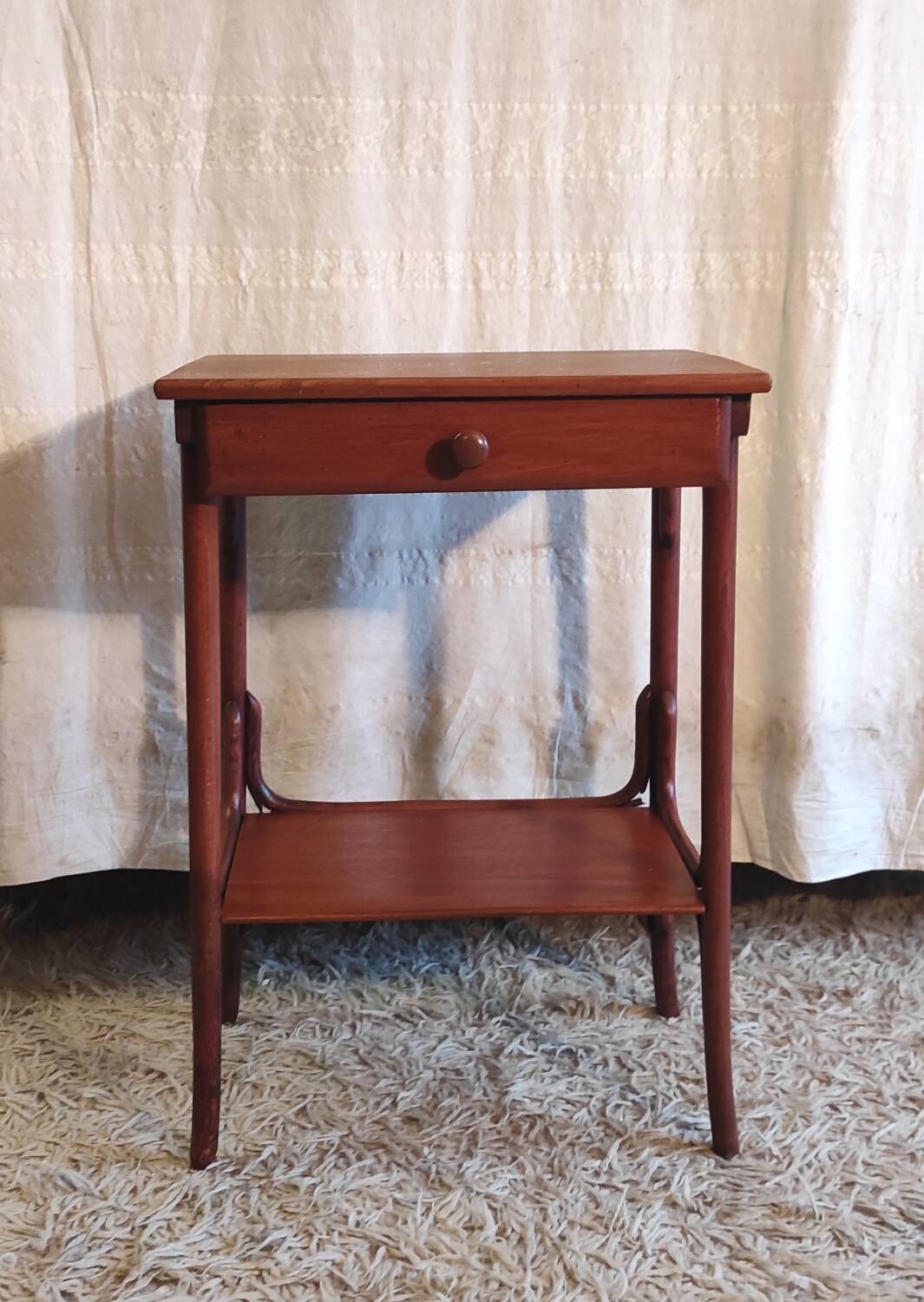 Curved solid wood side table - early 20th century