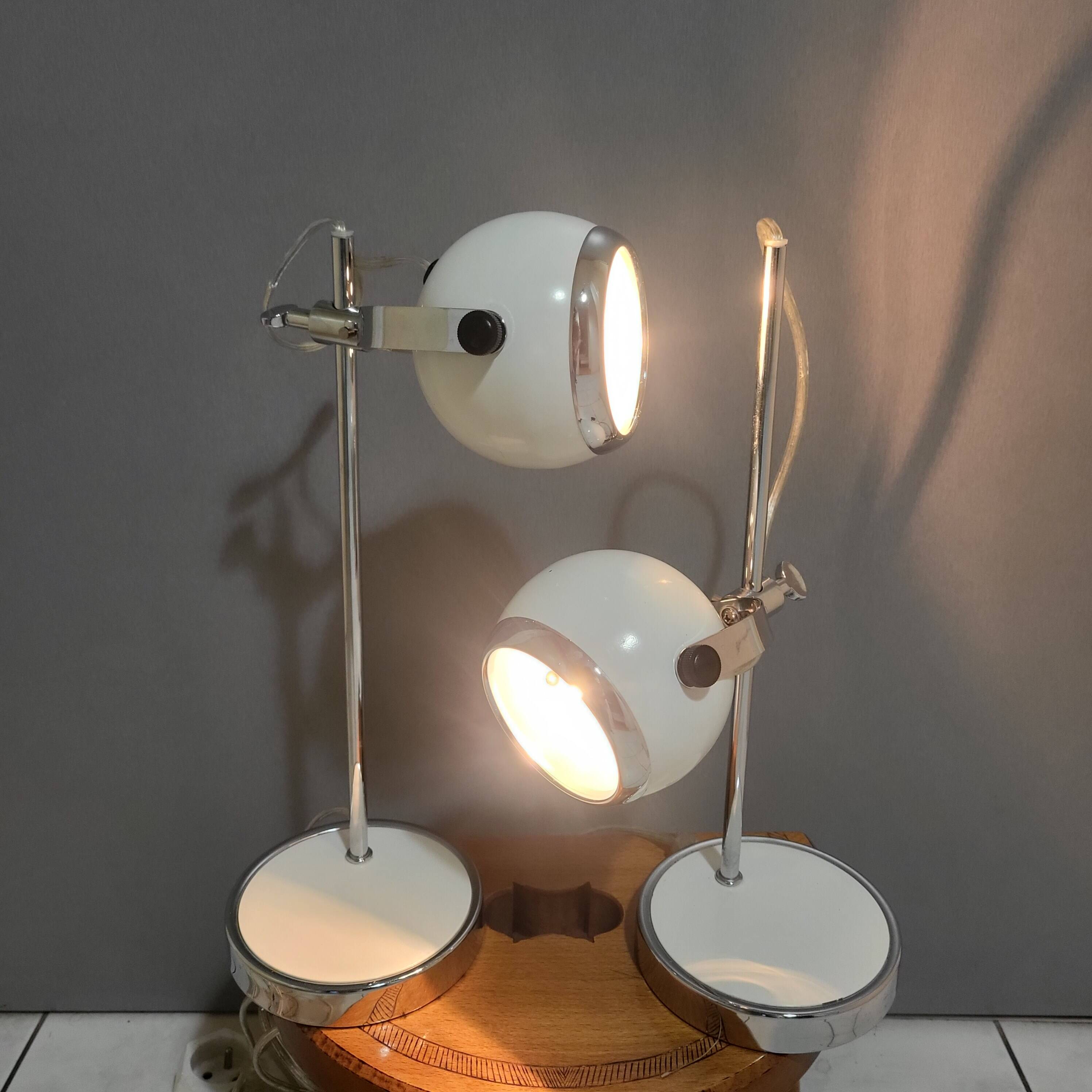 White and chrome metal eye ball lamps