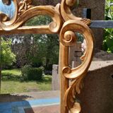 Ancien miroir doré à parcloses de style Régence d'époque 1930.