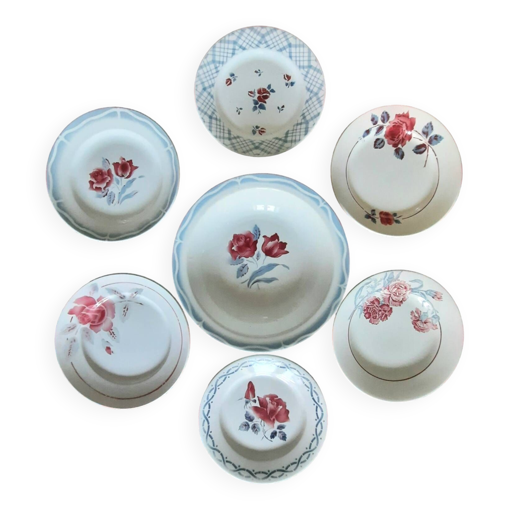 Mismatched antique flat plates in earthenware accompanied by a deep dish.