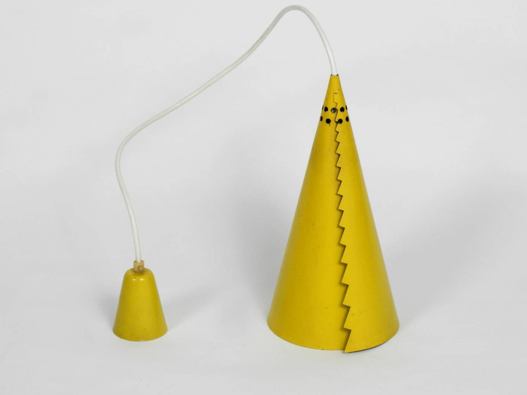 Rare Mid Century Modern cone shaped pendant lamp made of sheet steel in yel
