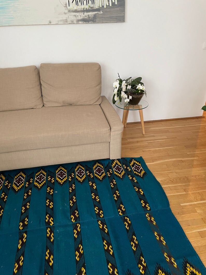 Romanian handwoven carpet with blue ground and yellow details