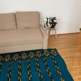 Romanian handwoven carpet with blue ground and yellow details