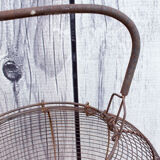 Old basket has wire eggs