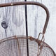 Old basket has wire eggs