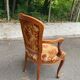 Louis XV armchair in carved solid wood and red and yellow fabric