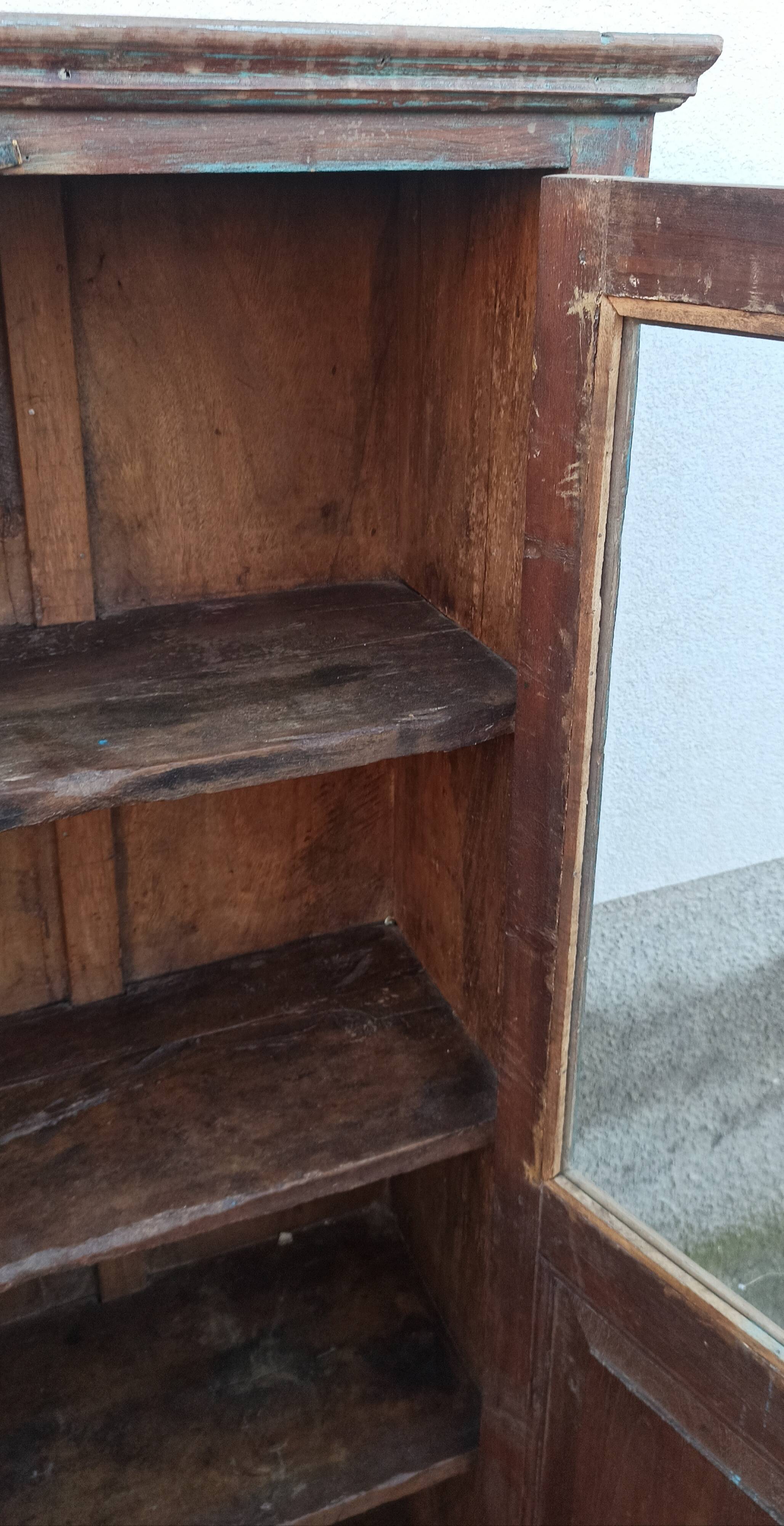 Old glazed wooden cabinet with beautiful patina