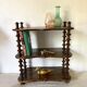 Old shelf in turned wood like reels