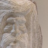 Carved stone head sculpture