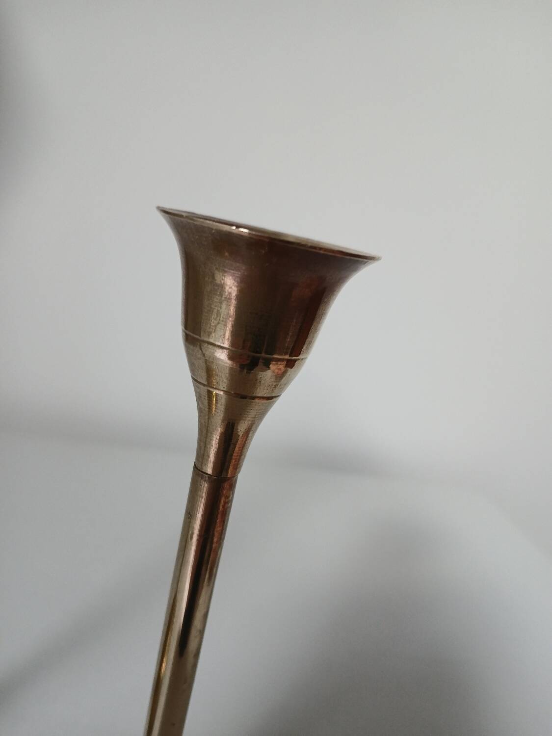 Set of two straight brass candlesticks.