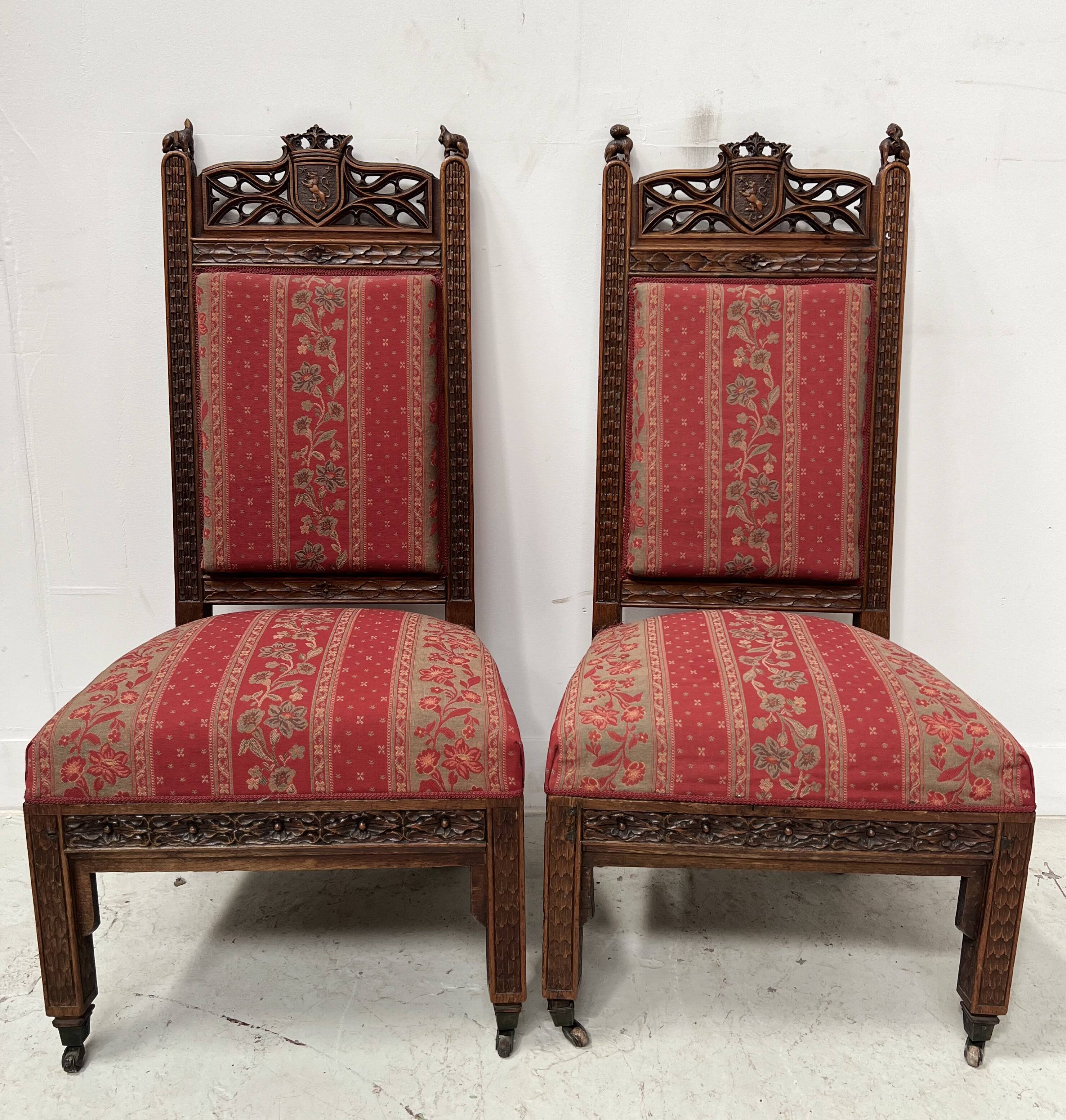 Pair of Gothic-style walnut lounge chairs, 19th century