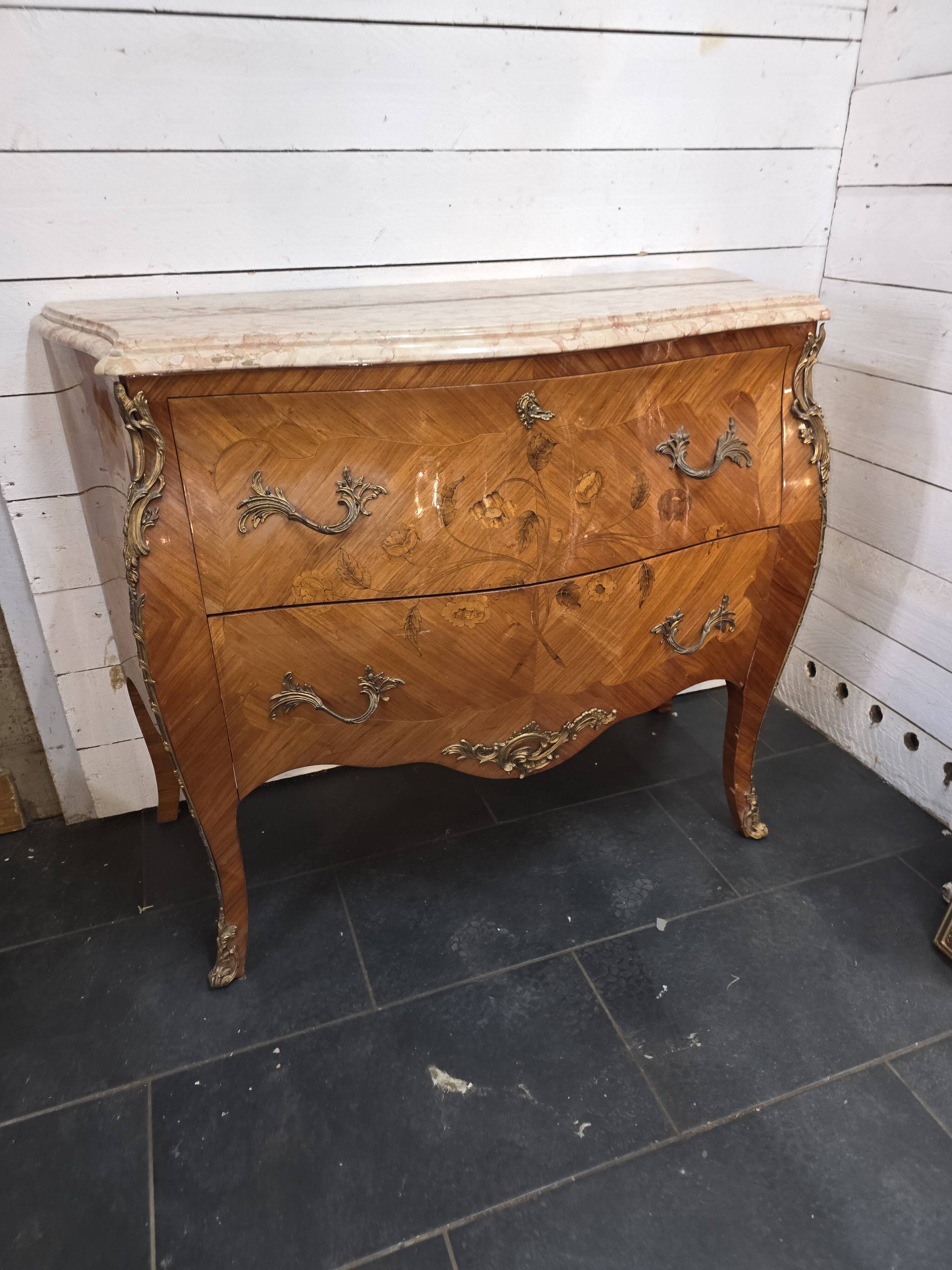 Louis XV style curved chest of drawers in marquetry