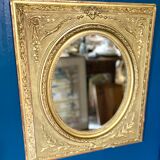 Mirror XIXth medallion on gilded frame with leaf