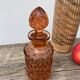 Art Deco perfume bottle in old amber pink glass