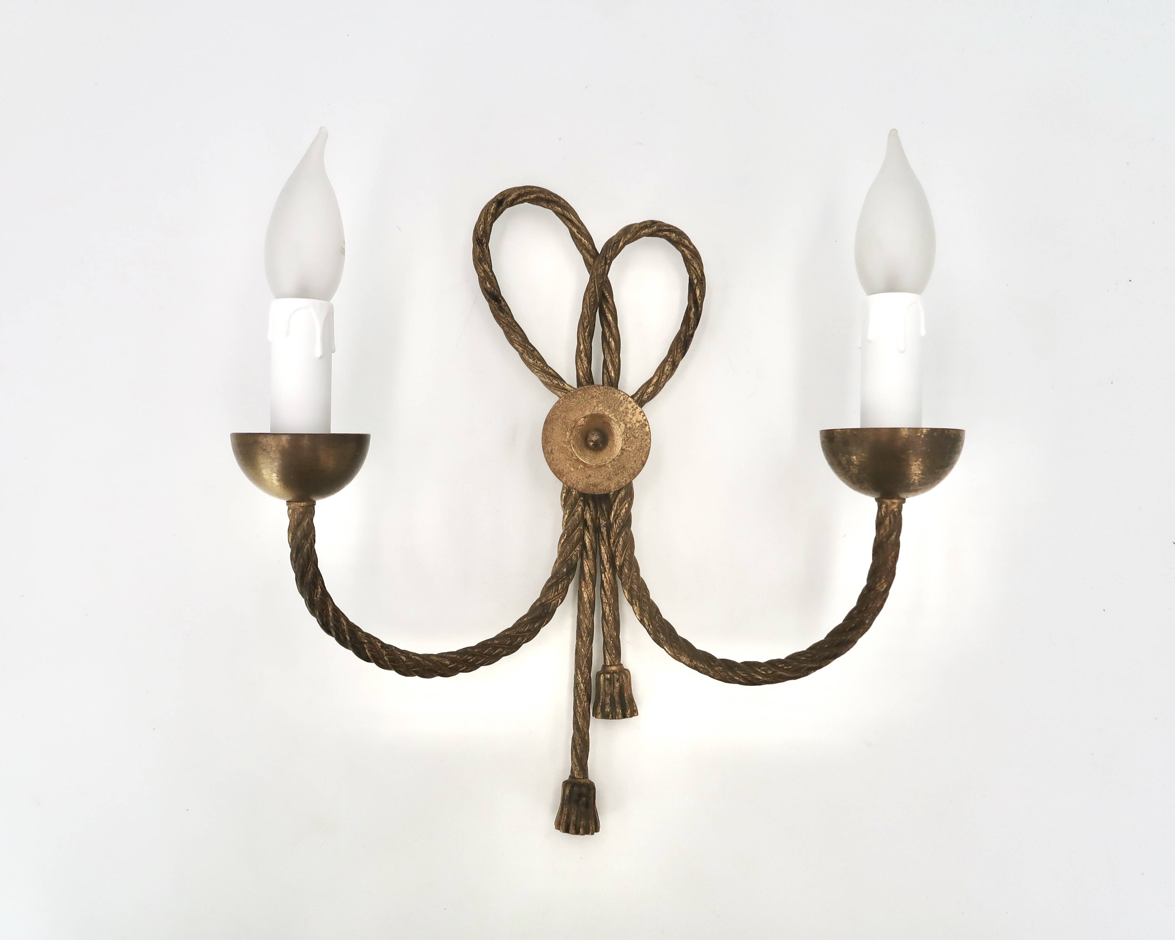 Golden wall lamp with two arms, decorated with a twisted rope bow, 1950s.