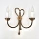Golden wall lamp with two arms, decorated with a twisted rope bow, 1950s.