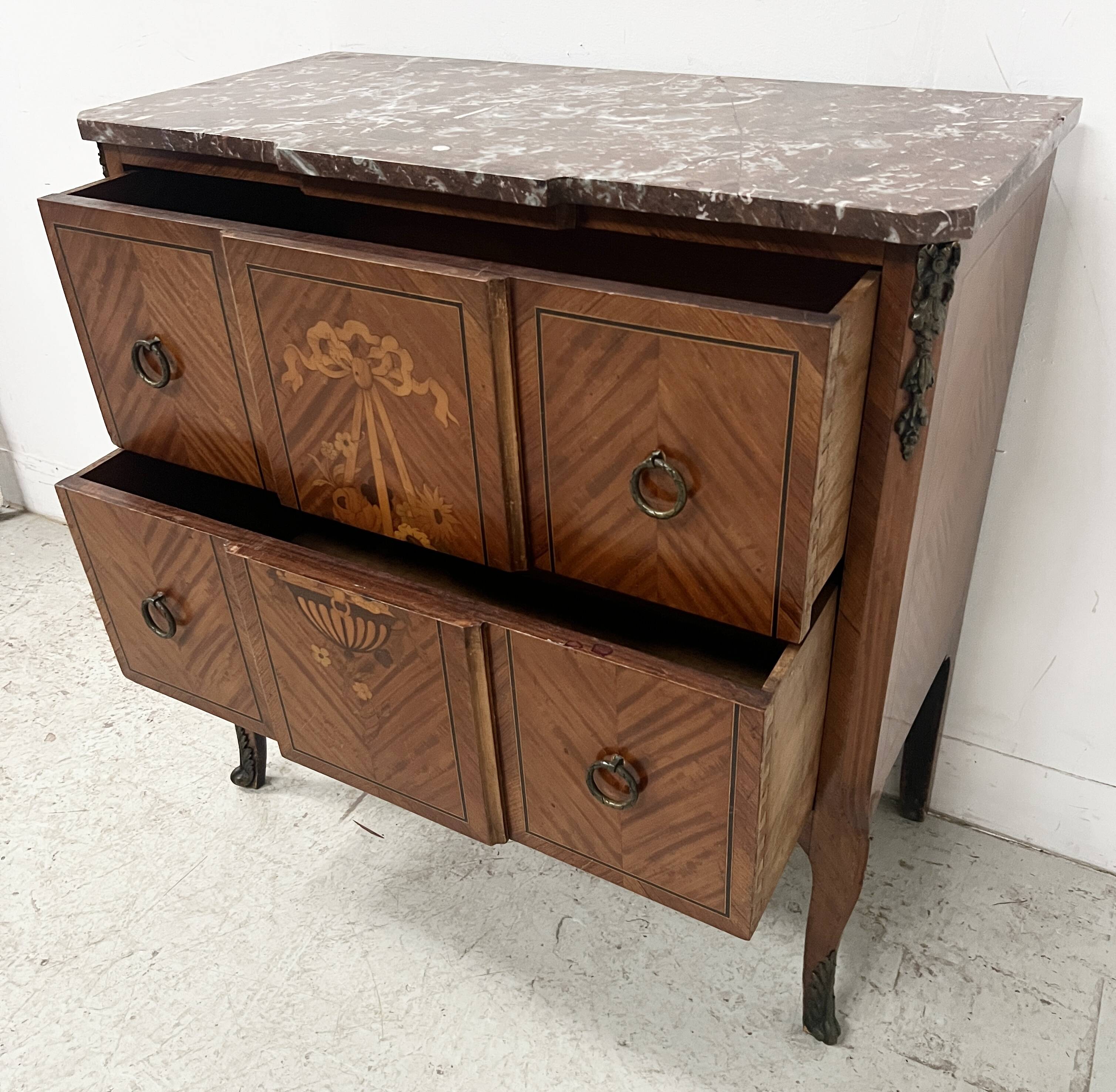 Transitional style commode with a protruding front, in marquetry wood, 20th century.