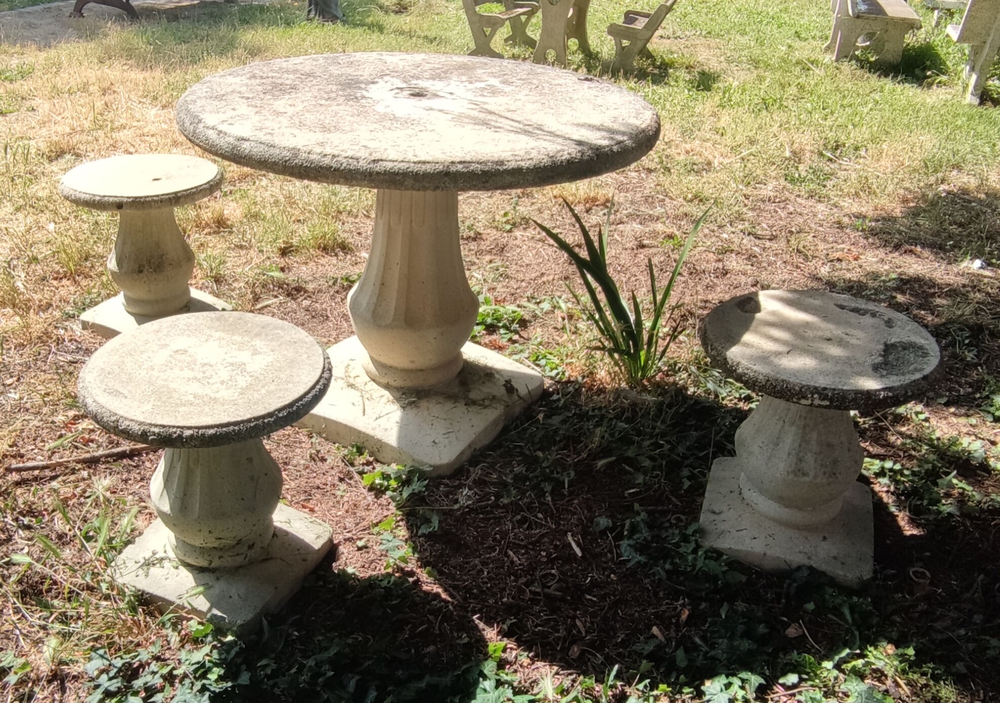 Old garden furniture in reconstituted stone