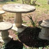 Old garden furniture in reconstituted stone
