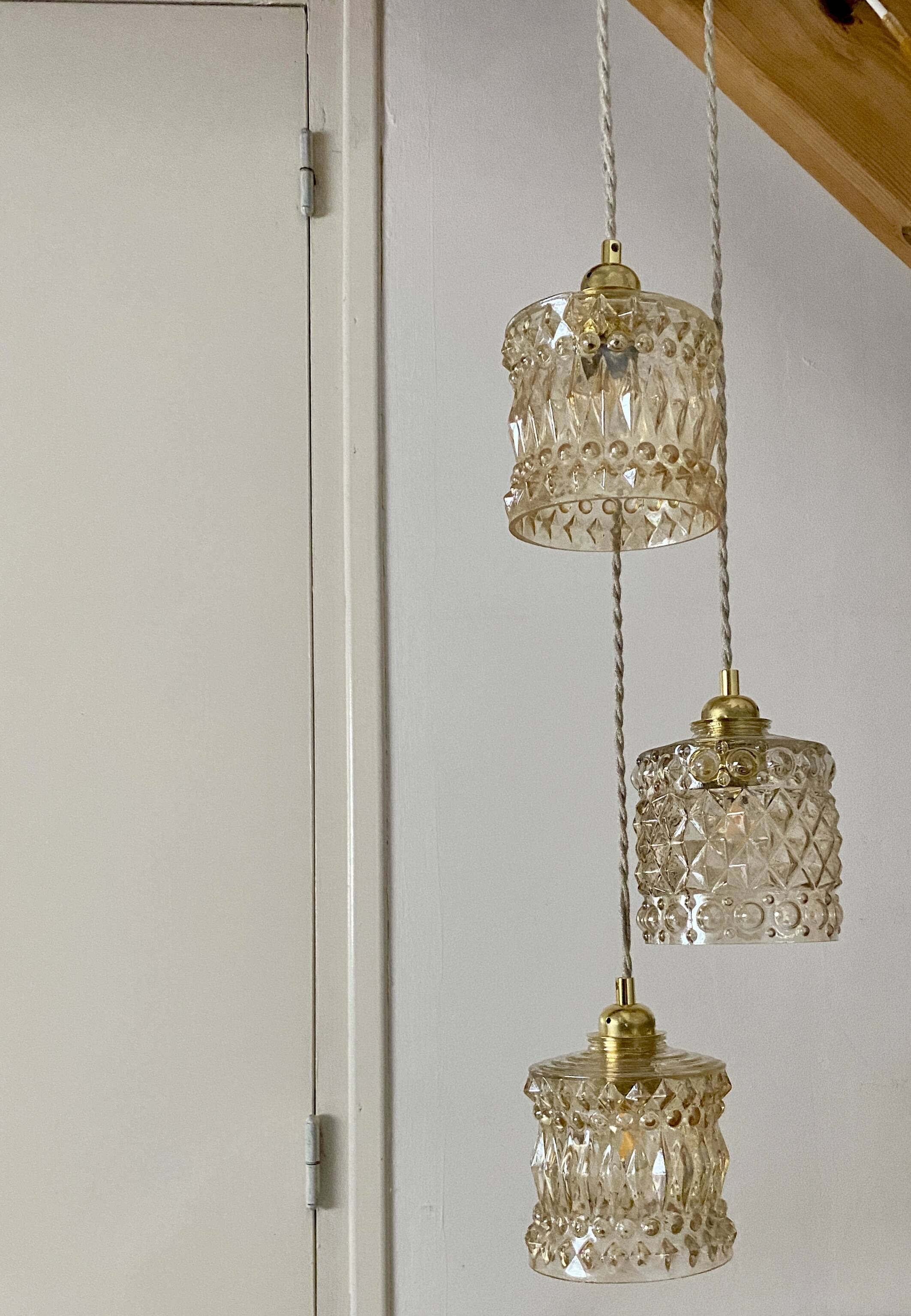 Triple antique globe pendant light in amber glass