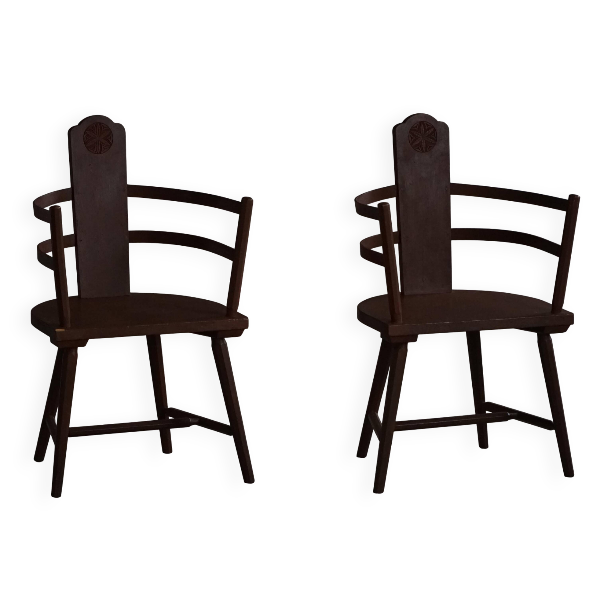 Pair of Scandinavian wooden armchairs with hand-carved folk motifs, 1920s.