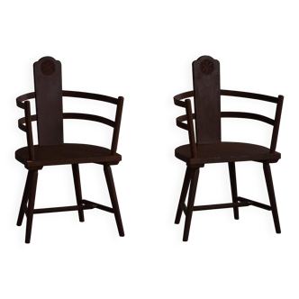 Pair of Scandinavian wooden armchairs with hand-carved folk motifs, 1920s.