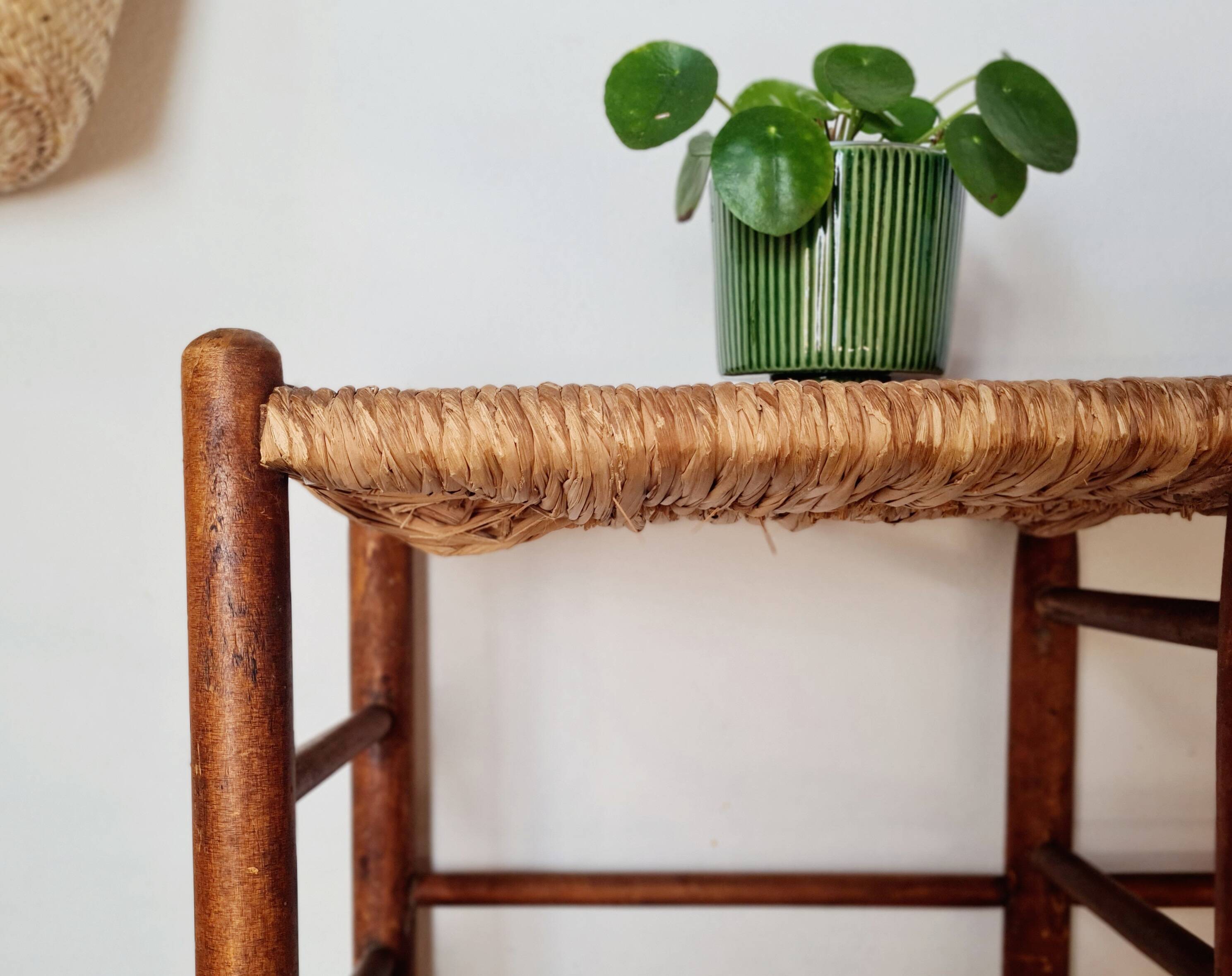 Old wooden and straw bench