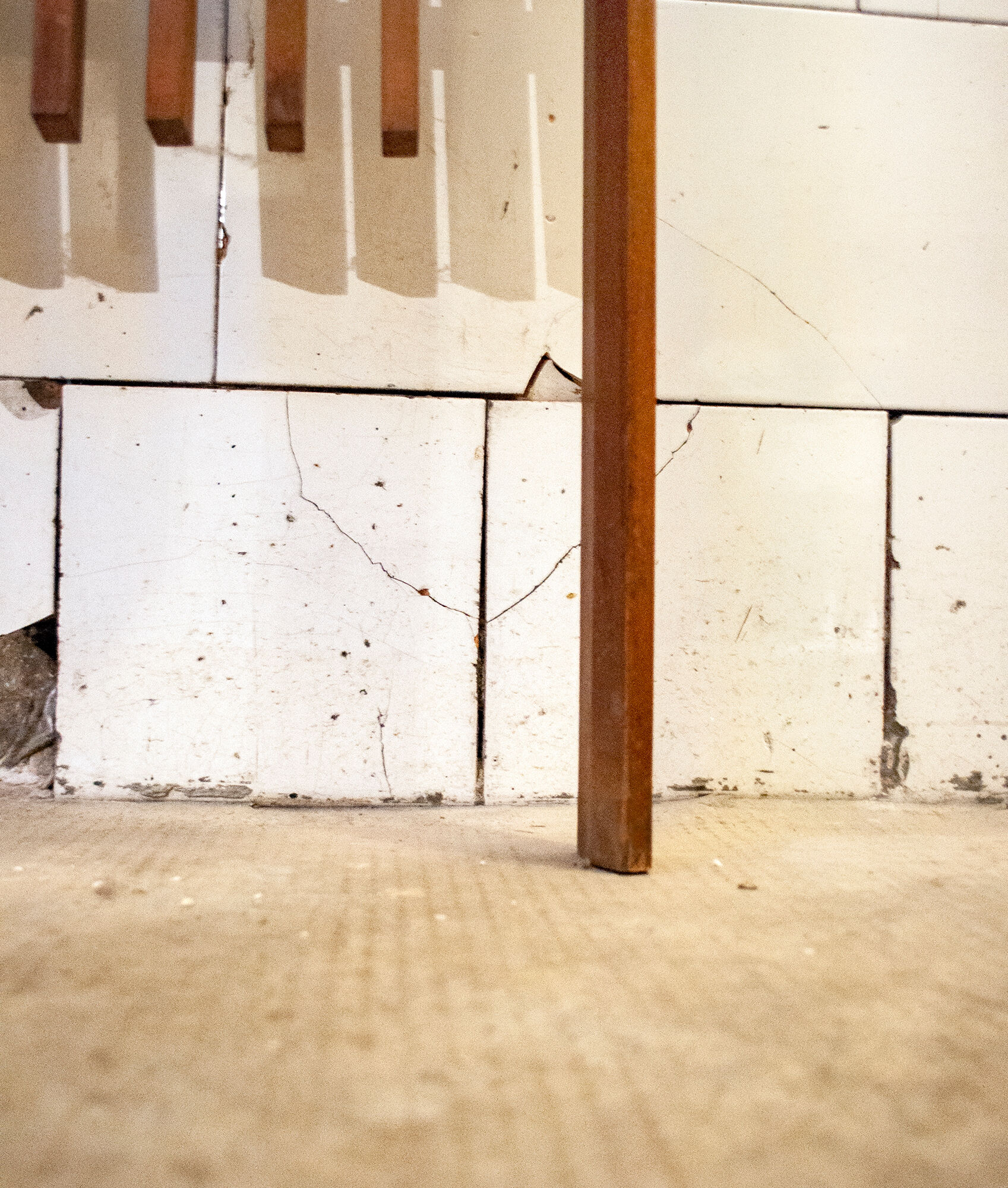 Walnut wood wall coat hangers, with metal details. Italian production 1950s