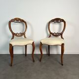 Pair of Victorian English chairs known as balloon chairs in solid mahogany.