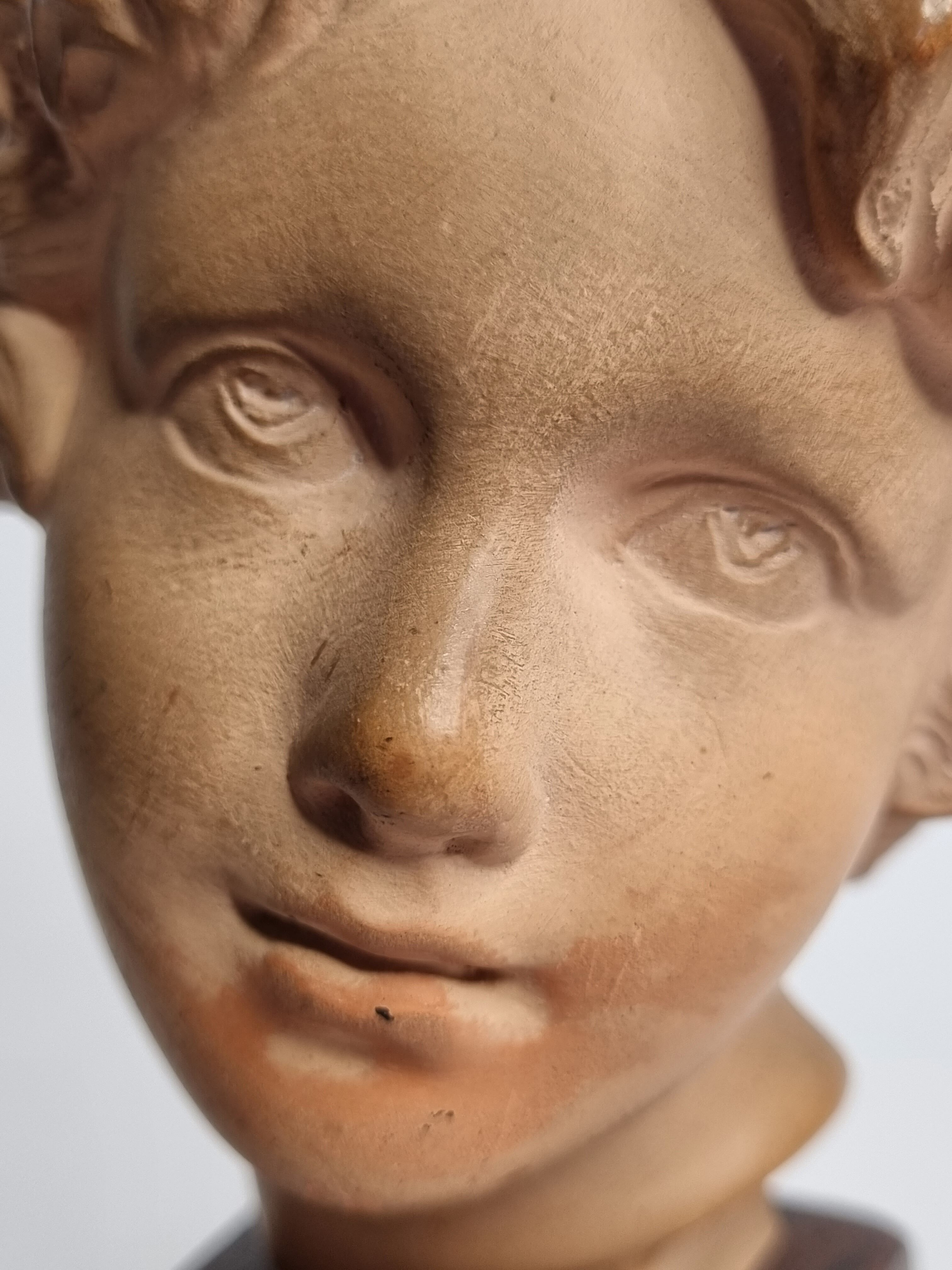 Bust of Bacchus child in patinated terracotta, 21 cm