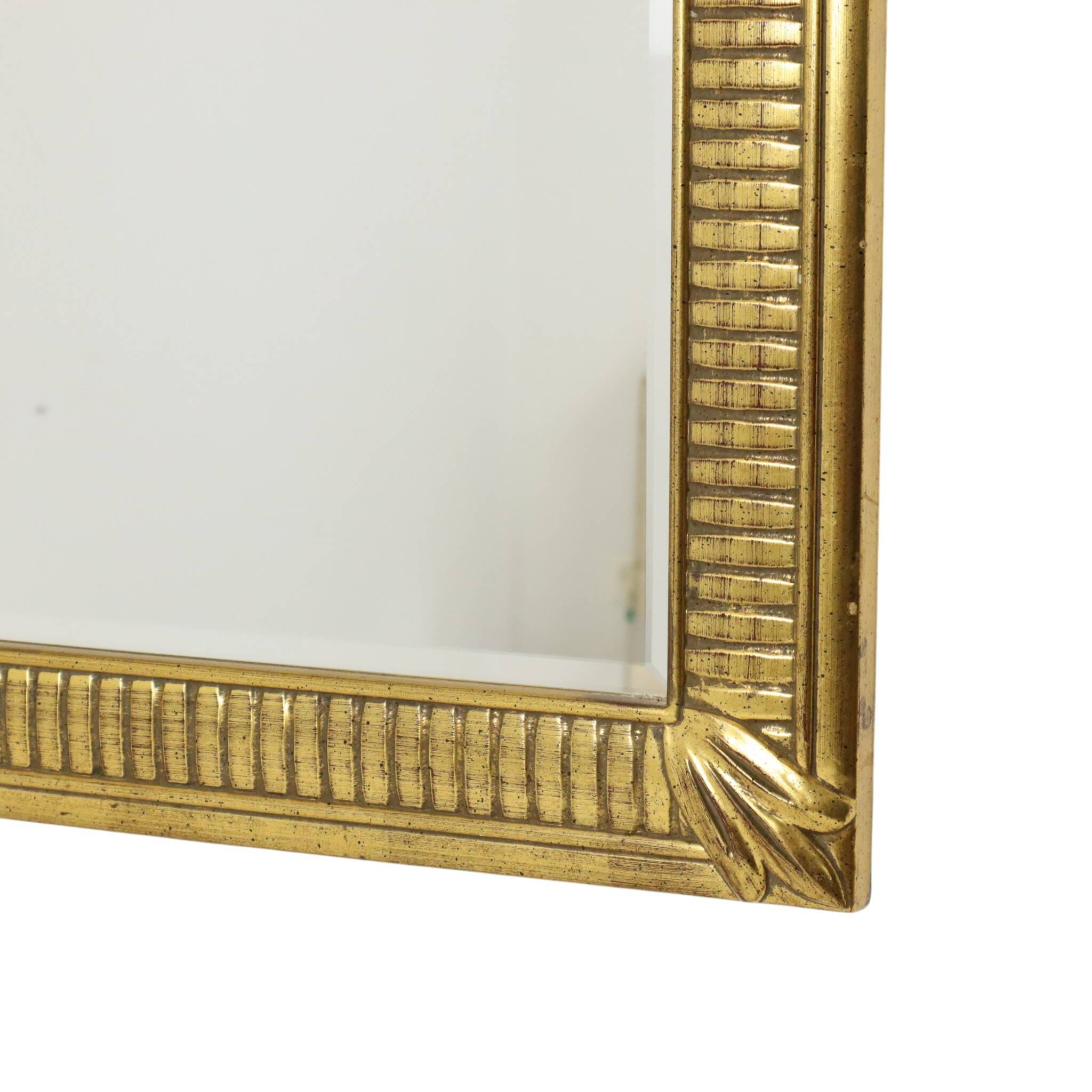 Miroir Deknudt en or Hollywood Regency biseauté 92 cm