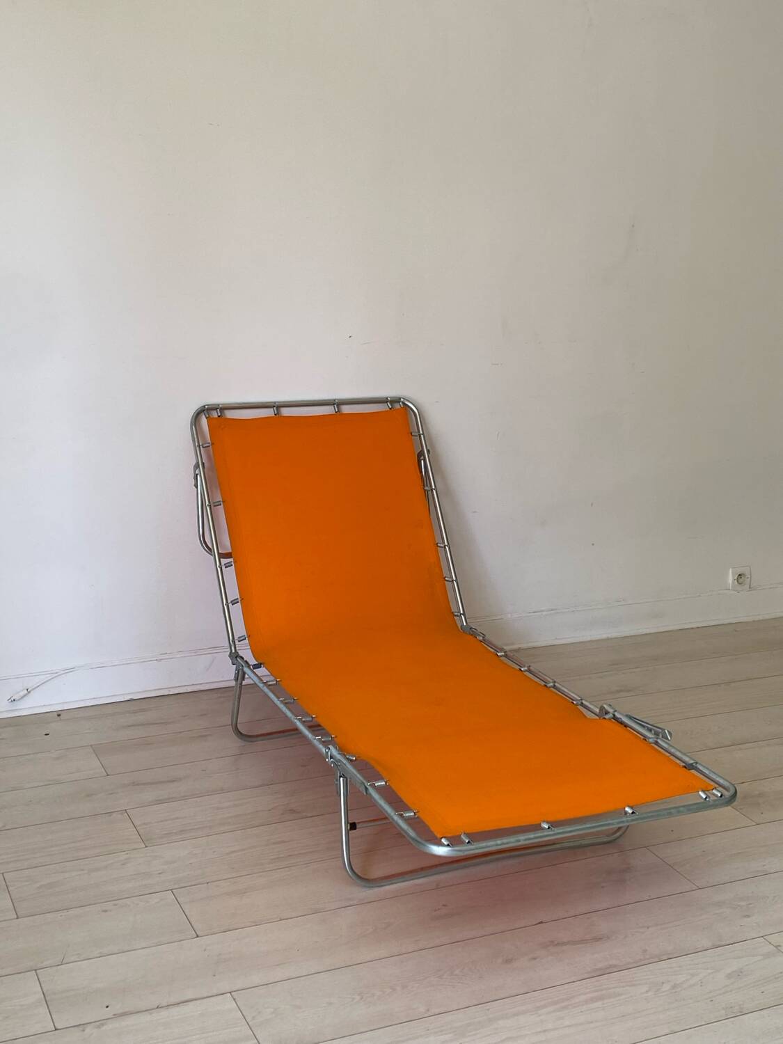 Orange and metal deckchair 1970