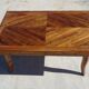 Antique solid walnut table with marquetry and extensions.