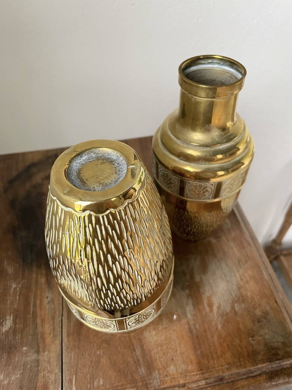 Duo of embossed brass vases