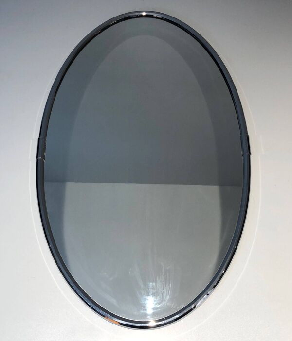 Miroir ovale chromé de style art déco. Vers 1970